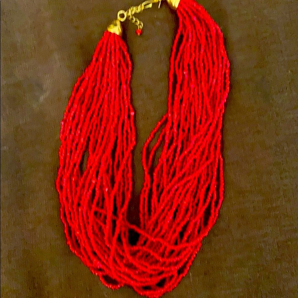 Red multi strand beaded necklace